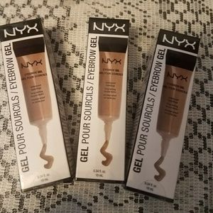 Three packages of Nyx eyebrow gel, in blond.